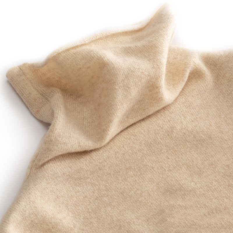 Beige cashmere turtleneck sweater on model, front view