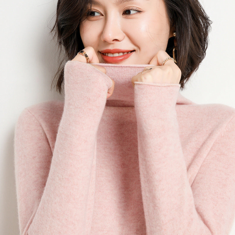 Dark camel cashmere turtleneck sweater on model