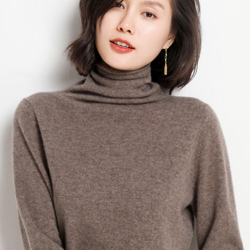 Cinnabar red cashmere turtleneck sweater on model, front view