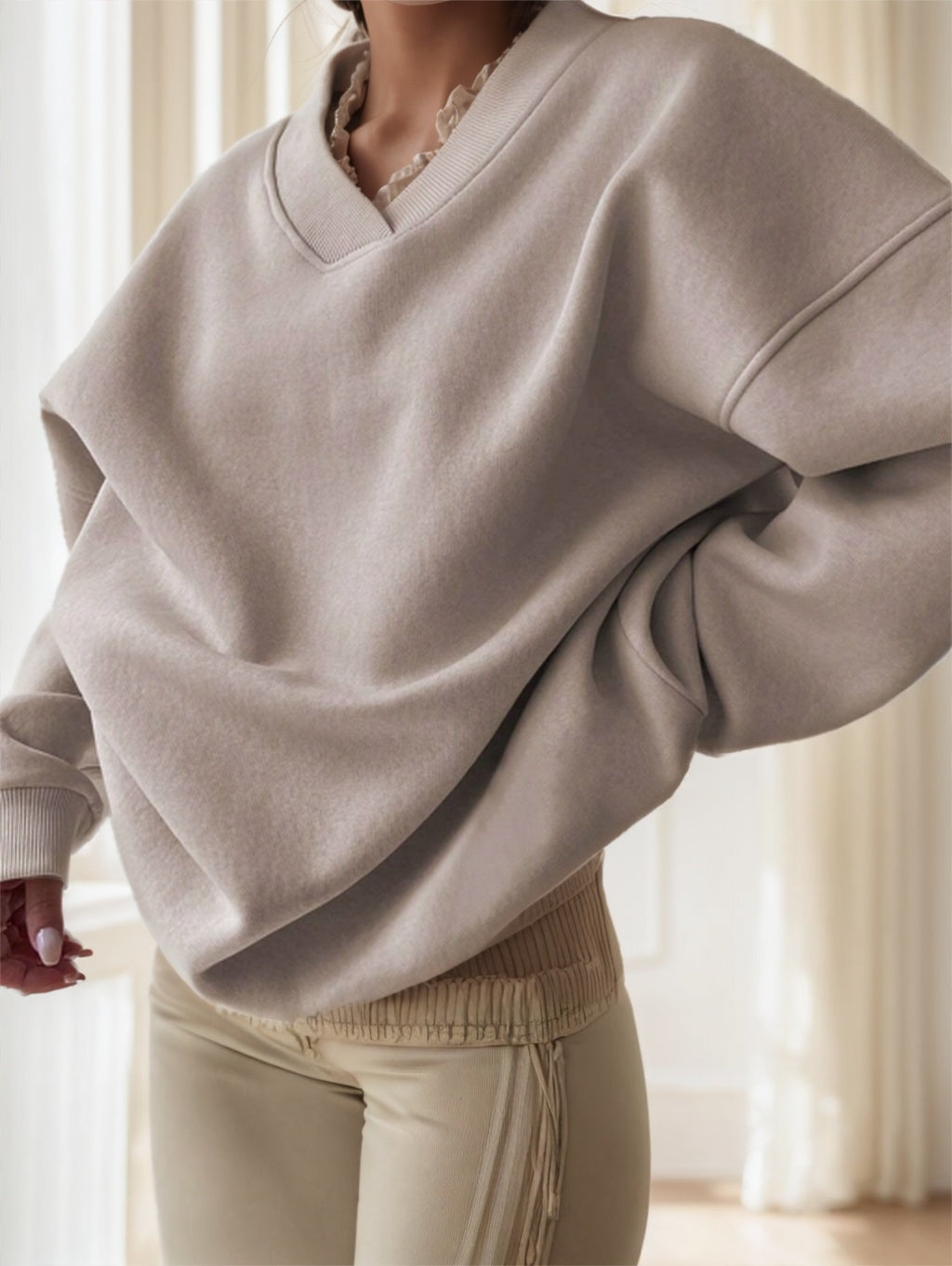 Apricot oversized drop-shoulder sweatshirt on model, front view