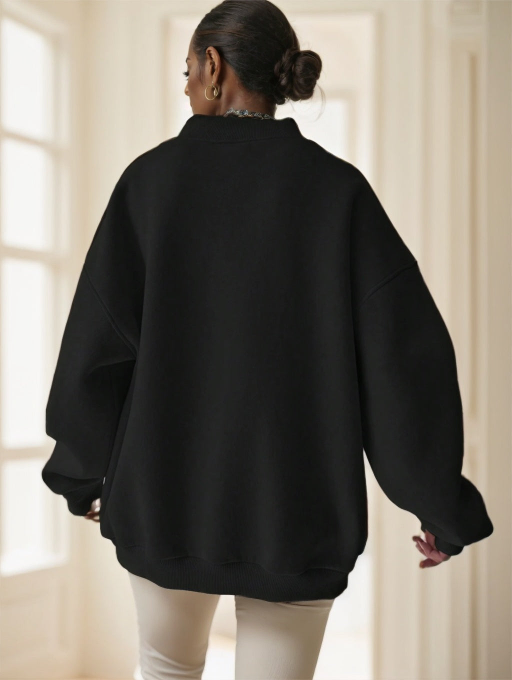 Black drop-shoulder oversized sweatshirt on model, front view