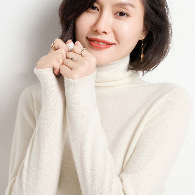 Woman wearing beige pure cashmere turtleneck sweater, close-up