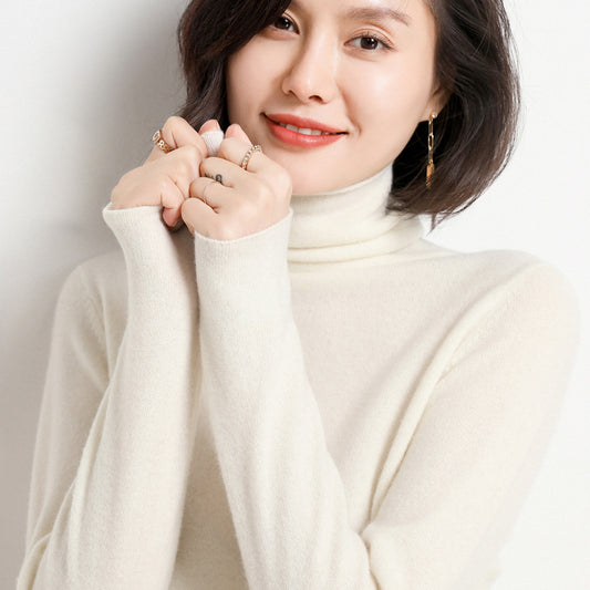Woman wearing beige pure cashmere turtleneck sweater, close-up