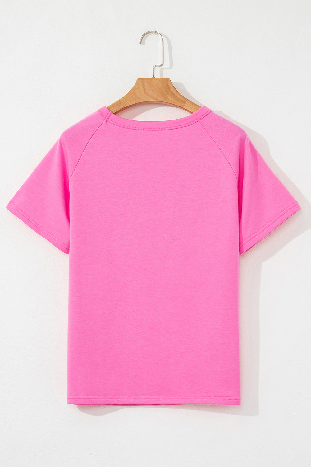 Back of a women's pink crew neck T-shirt with short sleeves and a relaxed everyday fit.