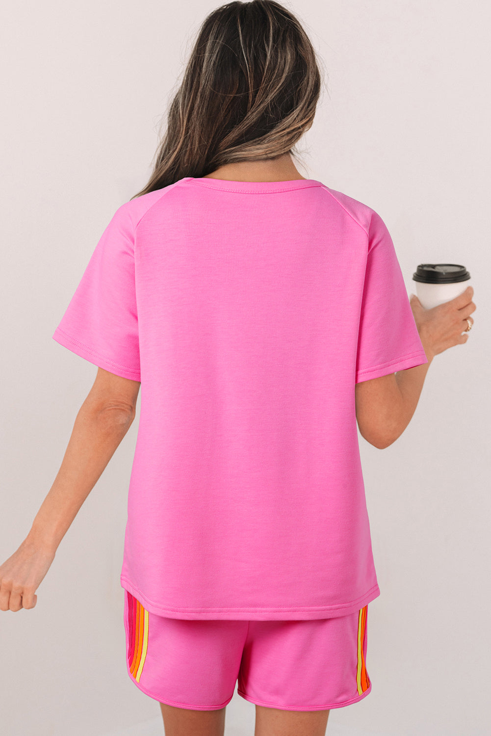 Back view of a pink short sleeve T-shirt featuring a relaxed fit and soft comfortable fabric.