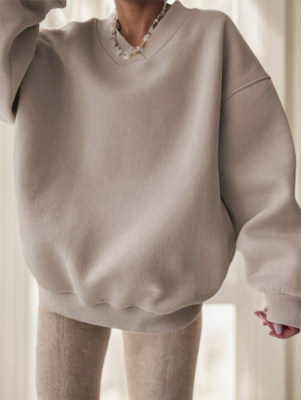 Back view of black oversized drop-shoulder sweatshirt