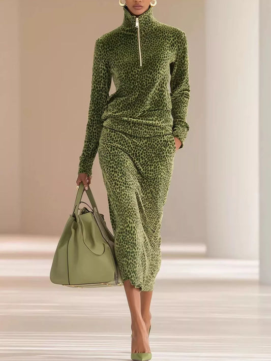 Woman wearing moss green Huntress leopard velour quarter-zip top with matching midi skirt
