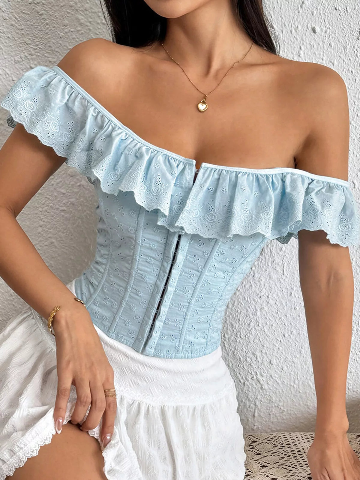 Duchess Eyelet Ruffle Corset Top in sky blue — front view on model